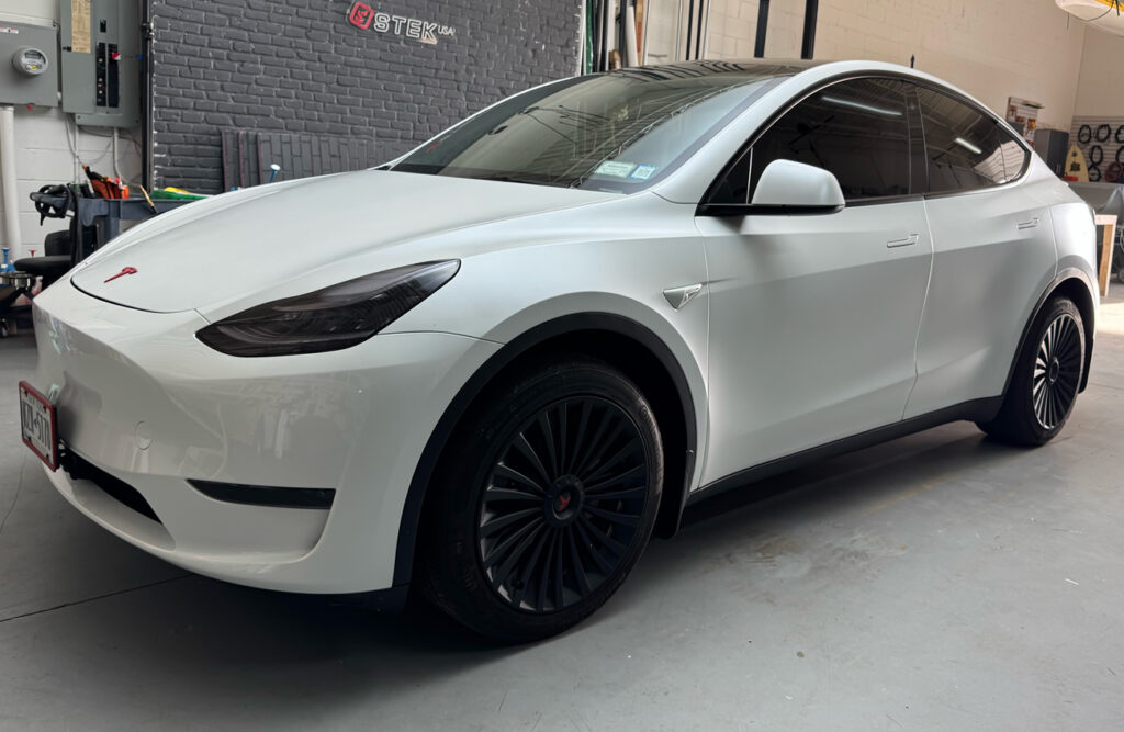 Model Y Tesla with stealth satin wrap by grand elite motors